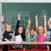 Enthusiastic,Group,Of,Young,Kids,In,Class,Sitting,In,A